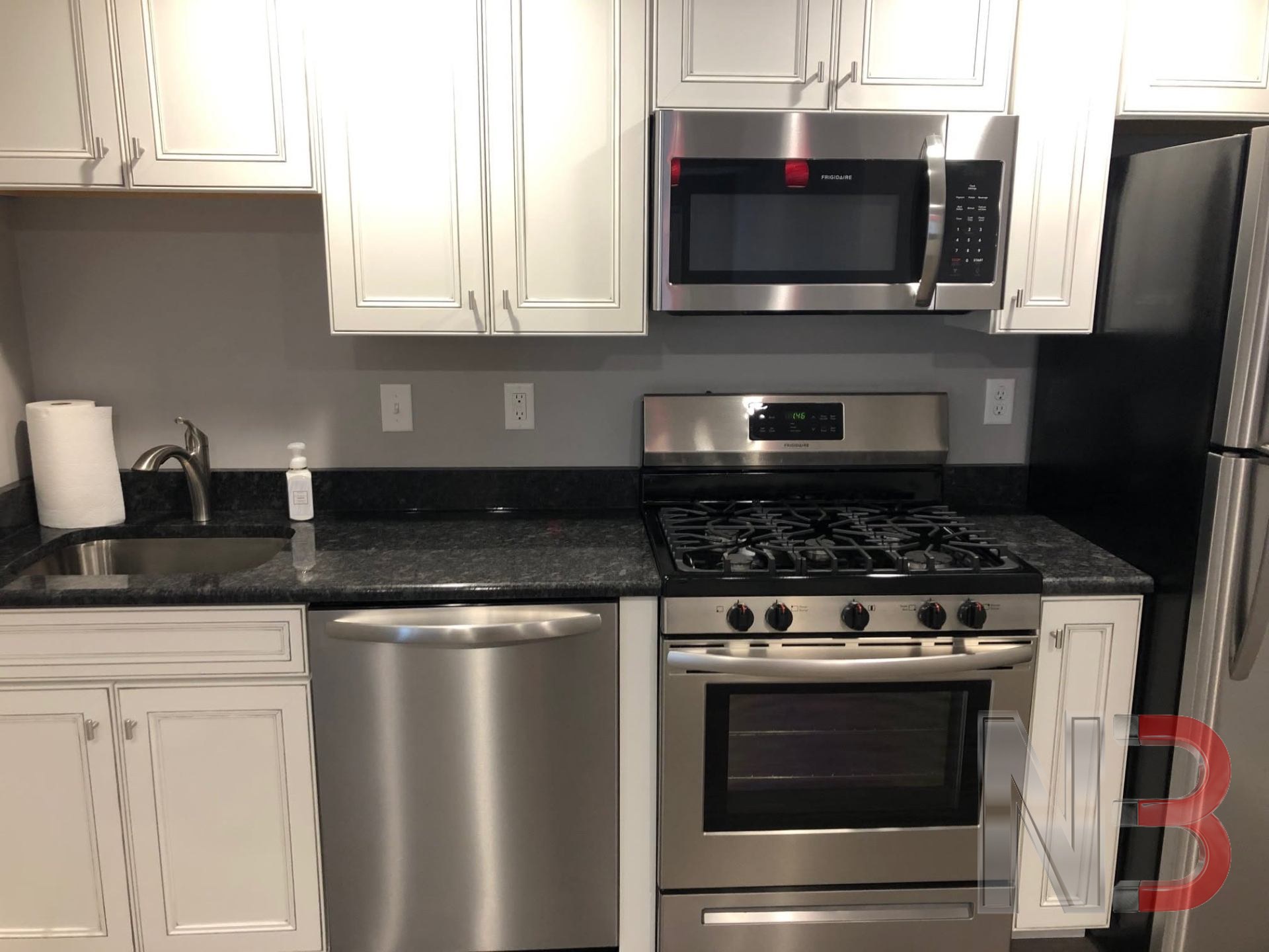 Kitchen with stainless appliances, new outlets and switches installed