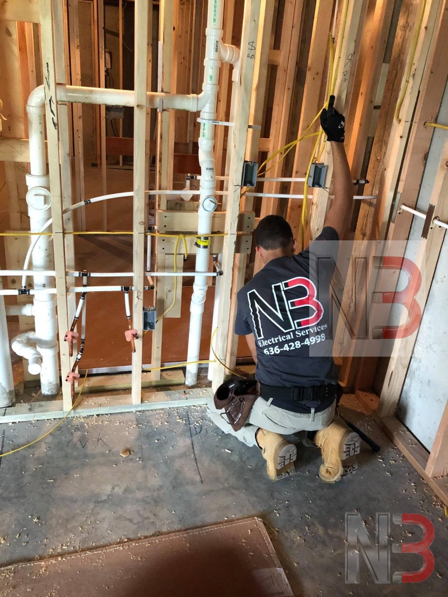 N3 Electrical Services electrician running new wire through wall framing during a rewire