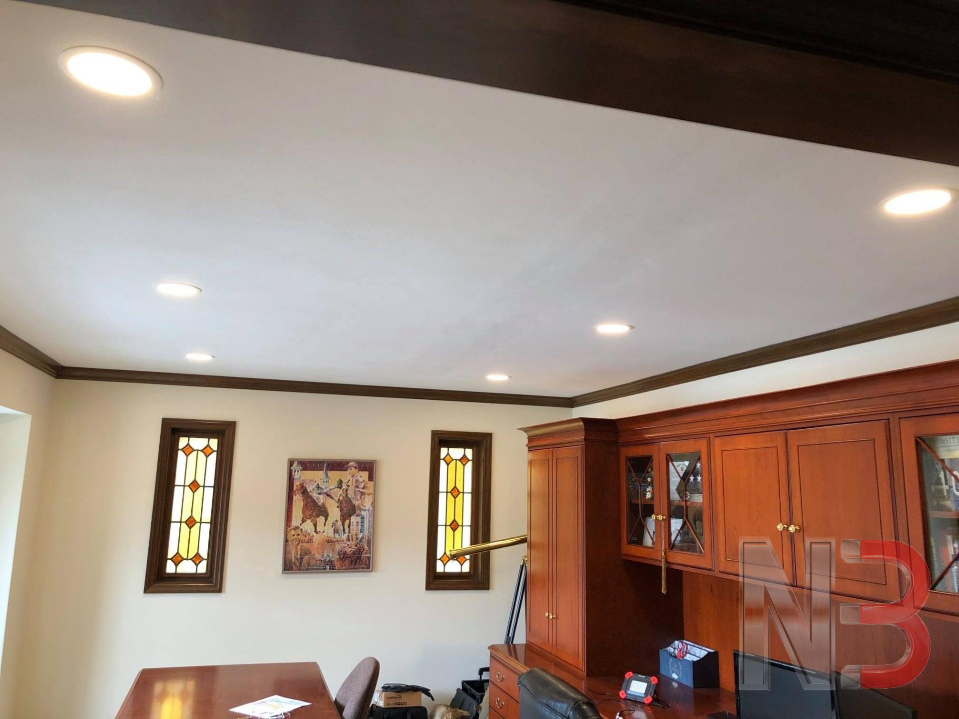 Finished room with new recessed ceiling lights after an electrical upgrade and inspection